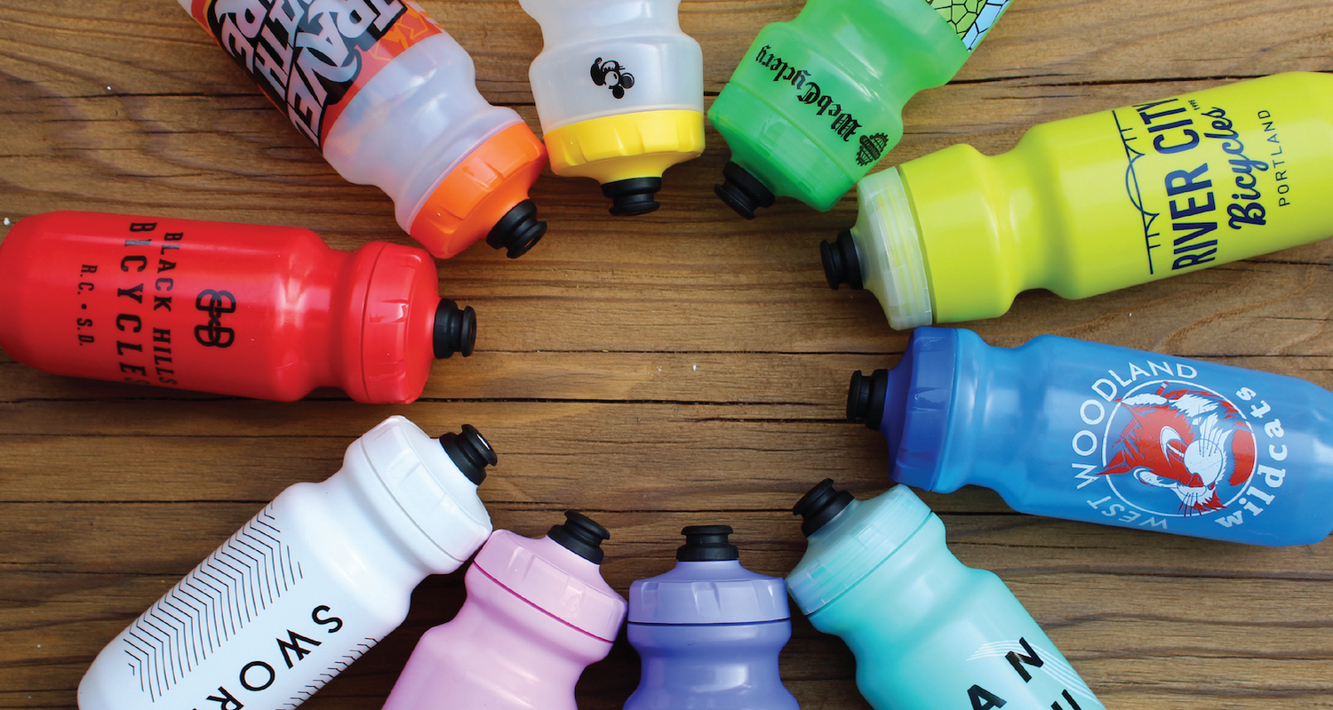 A circle of purist specialized bottles placed in a circle 